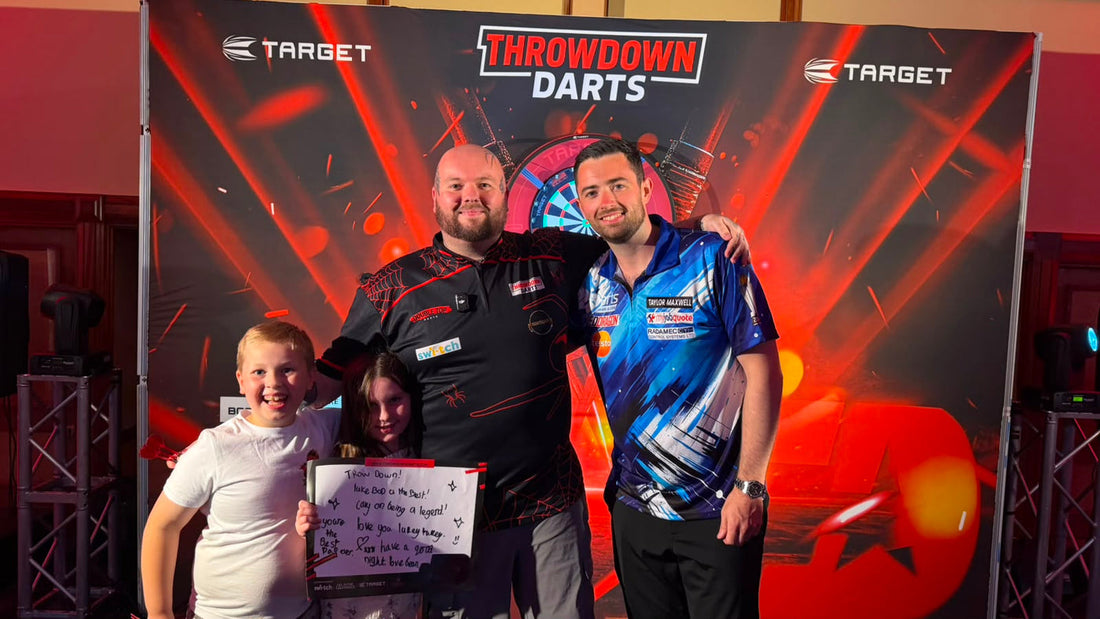 A packed crowd at a live darts exhibition night in the UK